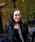 Smiling young woman in a leather jacket